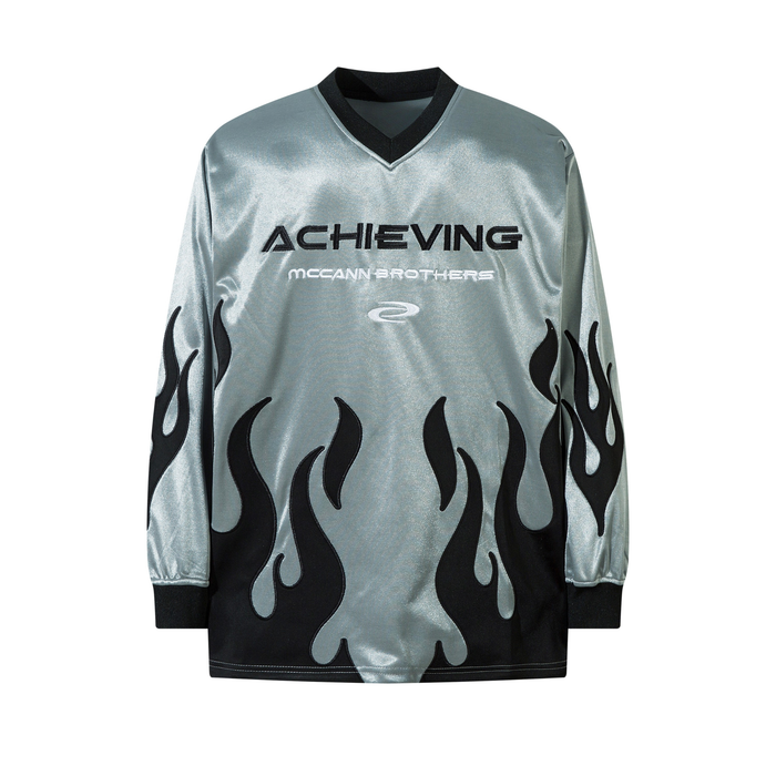 Silver long sleeve V-neck jersey with black flame graphic print and Achieving McCann Brothers embroidered branding