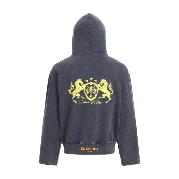 Dark washed hoodie back view with large yellow crest graphic and ribbed hem
