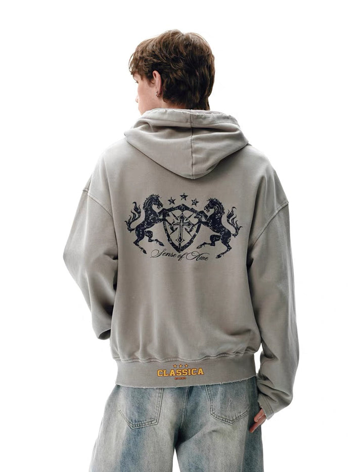 Light gray washed zip hoodie worn by model, back view with large crest graphic