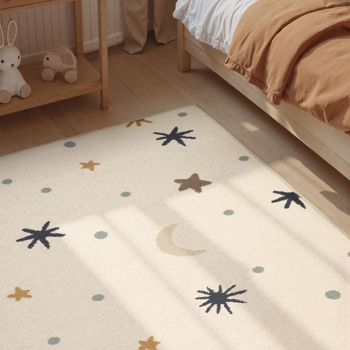 Children's room with a patterned rug featuring stars, moons, and planets.