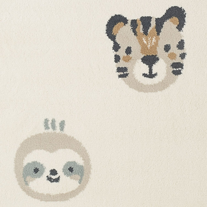 Rug with sloth and cheetah designs on a beige background