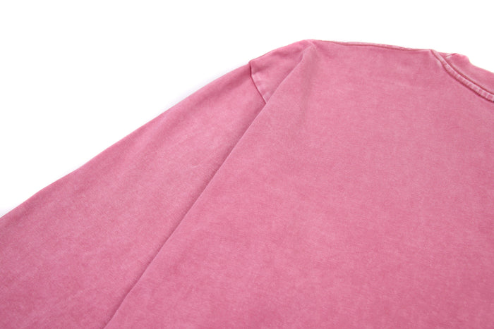 Back shoulder view of pink long sleeve cropped tee with plain fabric and seam detail