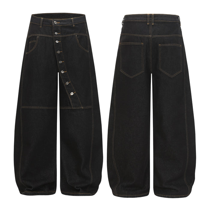 Front and back view of black wide-leg balloon denim pants with diagonal button fly and contrast amber stitching