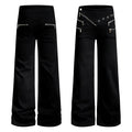 Black wide-leg flared pants with asymmetrical zipper waistband, metal eyelets, and multiple zip pockets, front and back view
