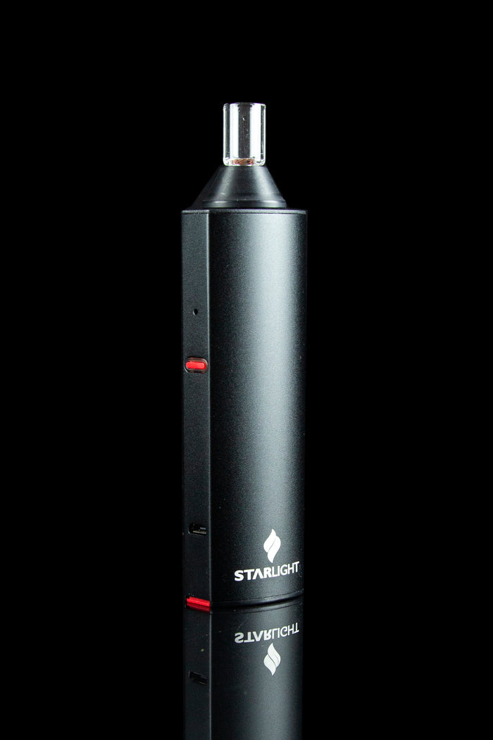Black Starlite vaporizer pen with a glass mouthpiece, displayed against a dark background.