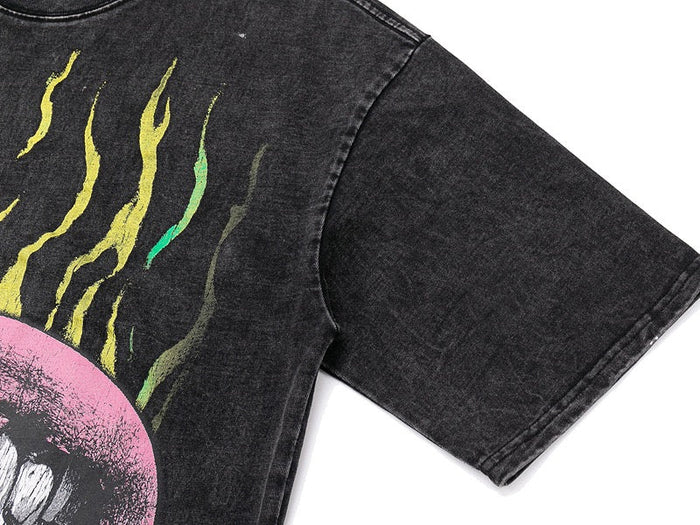 Washed black graphic tee with flame-print skull design and short sleeves