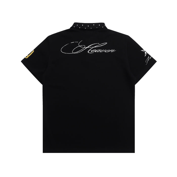 Black graphic polo shirt with studded collar and cursive back print, shown flat on a white background