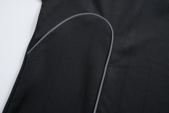 Black mesh athletic tee with gray piping and visible triple-stripe seam detail on the sleeve, close-up view