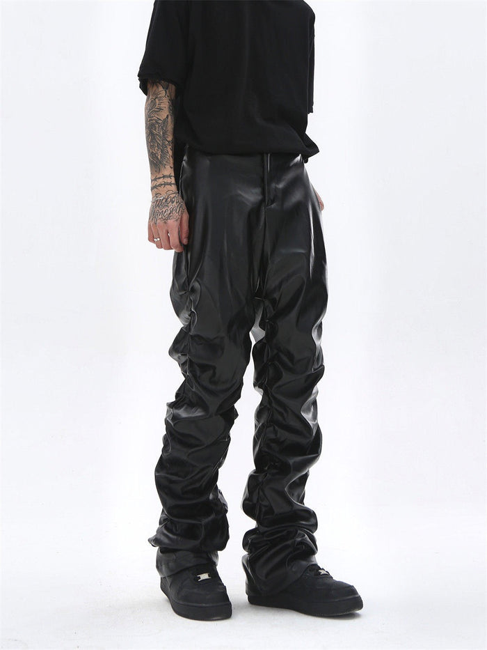 Black faux leather straight-leg pants worn front view, showing smooth waist and gathered legs