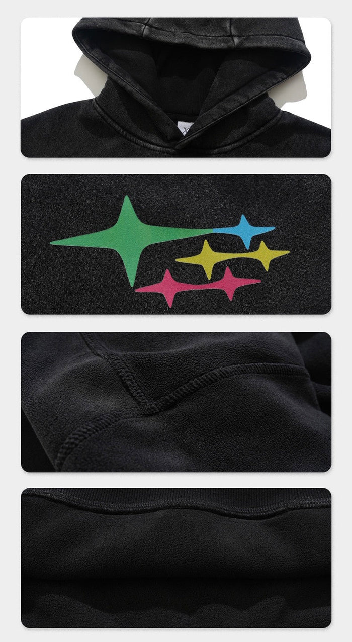 Close-up details of black hoodie hood, star chest graphic, seam stitching, and kangaroo pocket fabric