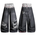 Front and back view of washed black distressed balloon jeans with camo double waistband and silver star embroidery