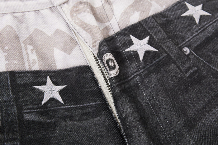 Close-up of layered waistband seam with zipper, star print and button details