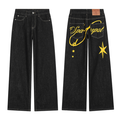 Front and back view of black wide-leg jeans with yellow star and script graphic print on rear panel