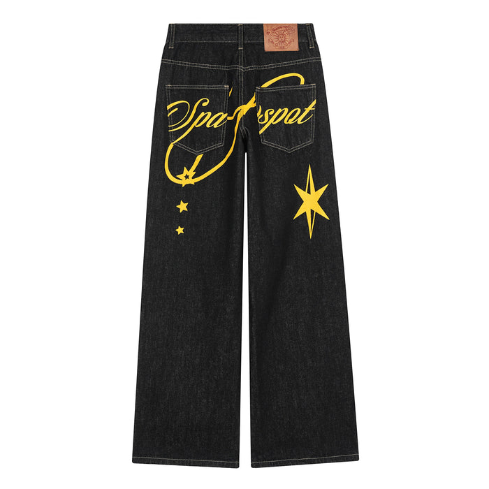 Back view of black wide-leg jeans with bold yellow script and star graphic