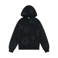 The Black Monochrome “Cotton Wreath” Denim Tears Hoodie is a minimal streetwear sweatshirt featuring a front pocket and subtle black floral patterns scattered across the fabric.
