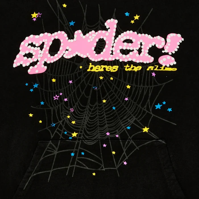The Sp5der “Hares the Slime” Hoodie features pink polka dot "spider!", yellow "heres the fl1p", a gray spiderweb, and scattered stars on black heavyweight 440GSM fleece—a standout streetwear pullover.