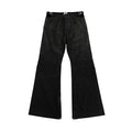 Front view of black wide-leg panelled jeans with curved seam detailing, adjustable waist tabs, and zip hem closures