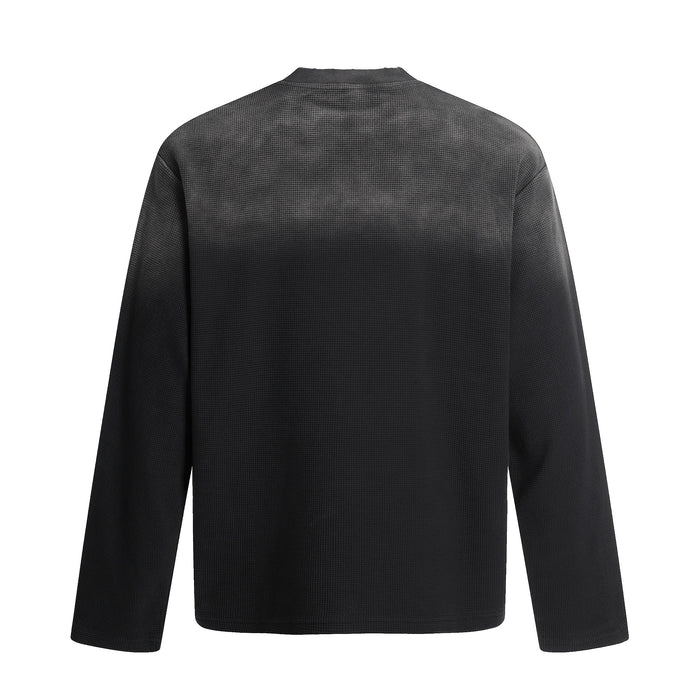Back view of black waffle knit long sleeve tee with plain solid back