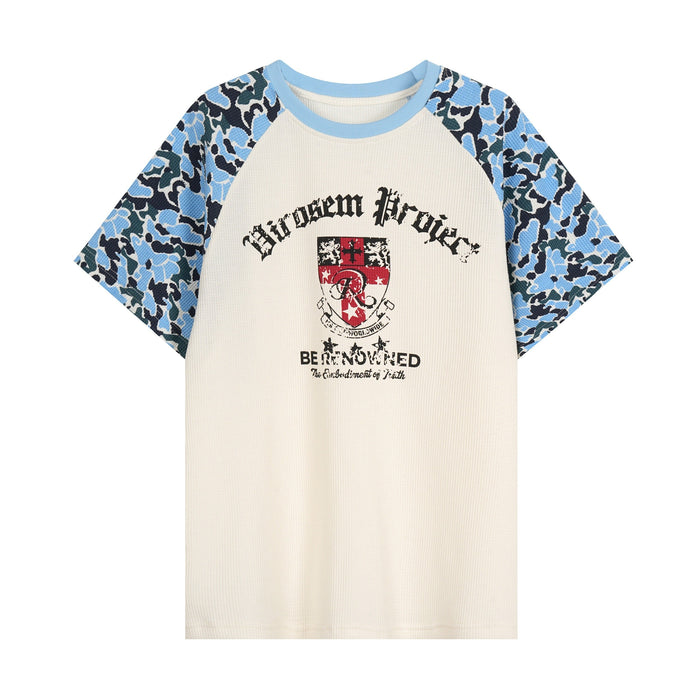 Cream raglan t-shirt with blue camo sleeves and distressed crest graphic print on the front