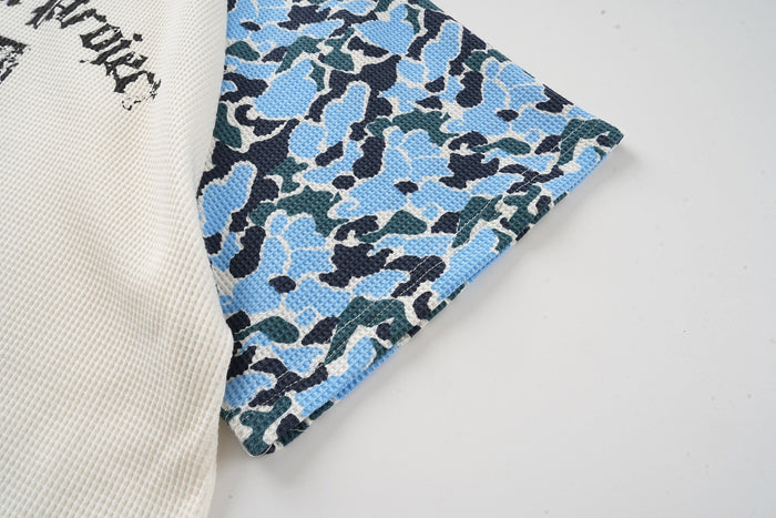 Blue camo raglan T-shirt sleeve in textured waffle knit with cream body and streetwear graphic print