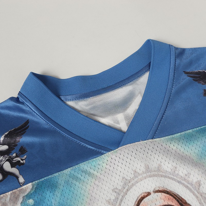 Blue football jersey with Sacred Art Jesus graphic and ribbed V-neck collar close-up