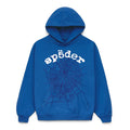 The Sp5der OG Web Hoodie 440GSM is a royal blue heavyweight cotton fleece sweatshirt featuring a bold black spiderweb graphic with "sp5der" in white above, plus a front pocket and hood.