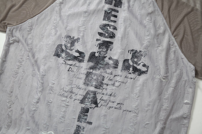 Distressed grey mesh patchwork tee with faded black graphic lettering and textured jersey fabric