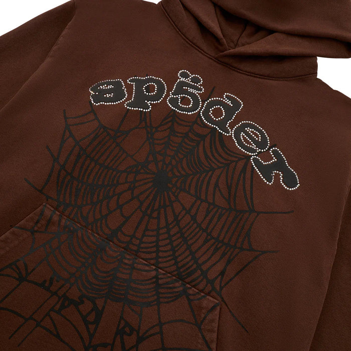 The Sp5der Web Hoodie – Mocha Brown 440GSM Heavyweight Streetwear Pullover features a bold black web graphic and "sp5der" text on mocha brown, finished with sparkling rhinestones for eye-catching style.