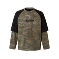 Oversized camo long sleeve tee with black textured raglan shoulder panels and distressed chest graphic, front view