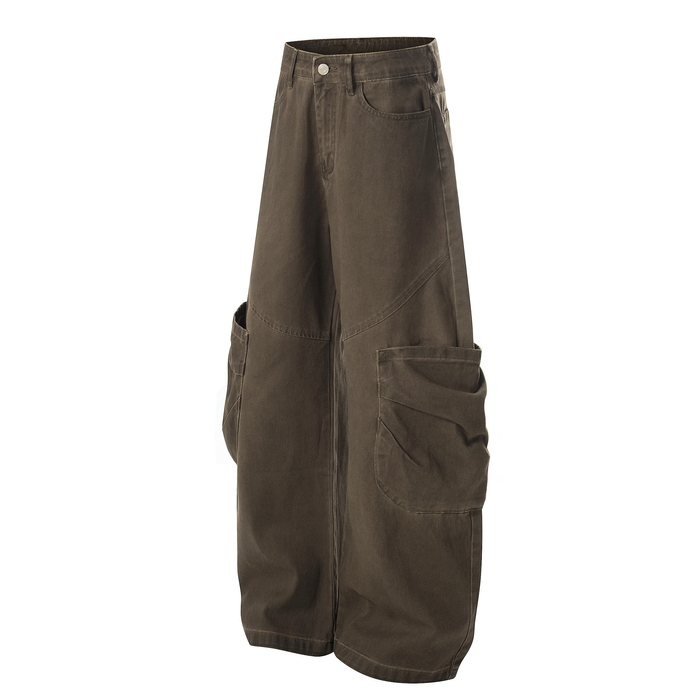 Angled front view of brown cargo pants with wide legs and oversized side pockets