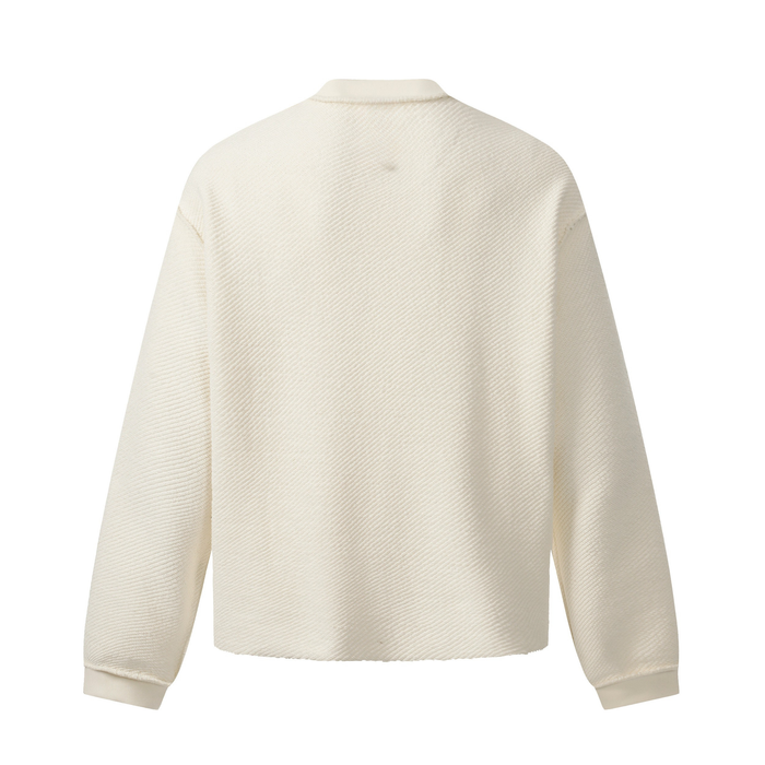 Back view of cream textured sweatshirt with plain panel and long sleeves