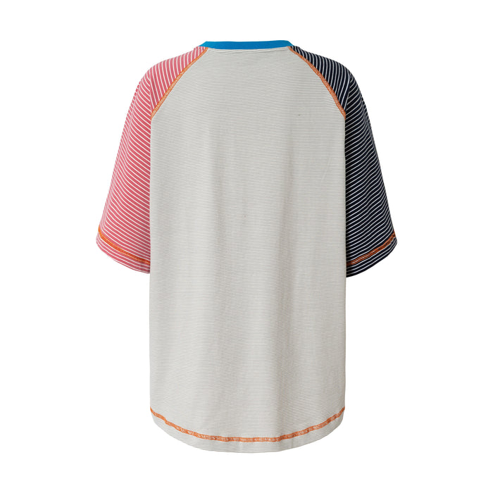 Relaxed fit color block raglan T-shirt with striped sleeves, blue collar, and contrast orange stitching on white background