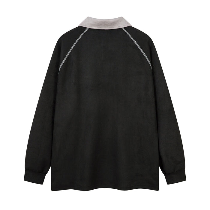 Back view of black long-sleeve polo shirt with light gray collar and contrast shoulder seams