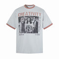Light gray ringer T-shirt with pink trim and vintage band graphic featuring the word Creativity on the front