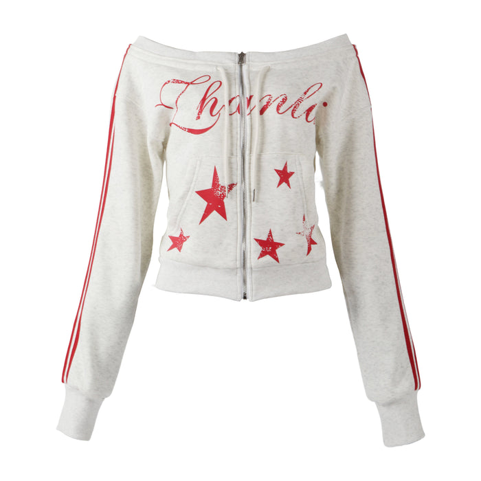 Off-shoulder white cropped zip hoodie with red star print and sleeve stripes, front view