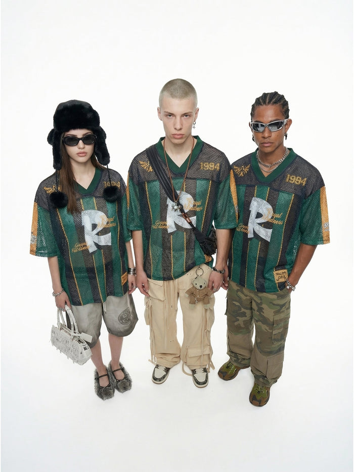 Models wearing oversized green mesh jersey T-shirts with 84 print, styled with streetwear accessories and cargo pants