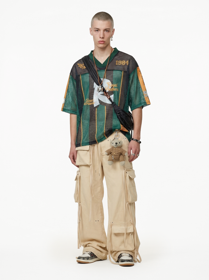 Seakoff Royal Madness mesh jersey T-shirt styled with green stripes, oversized cargo pants, and crossbody bag