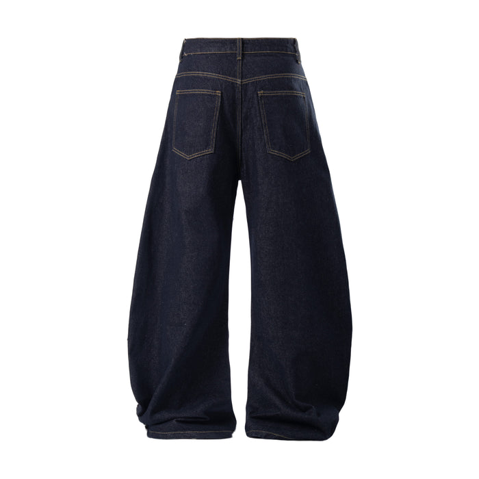 Back view of dark baggy jeans with oversized pockets and wide legs