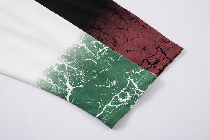 Close-up of long sleeve cuff with green cracked gradient print