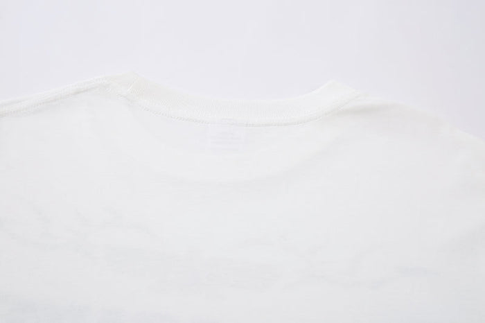Close-up of white tee neckline and collar stitching
