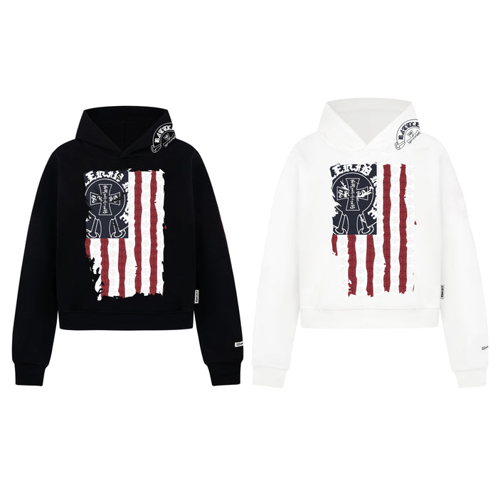 Black and white pullover hoodies with distressed American flag and cross emblem chest graphic, shown side by side on white ba
