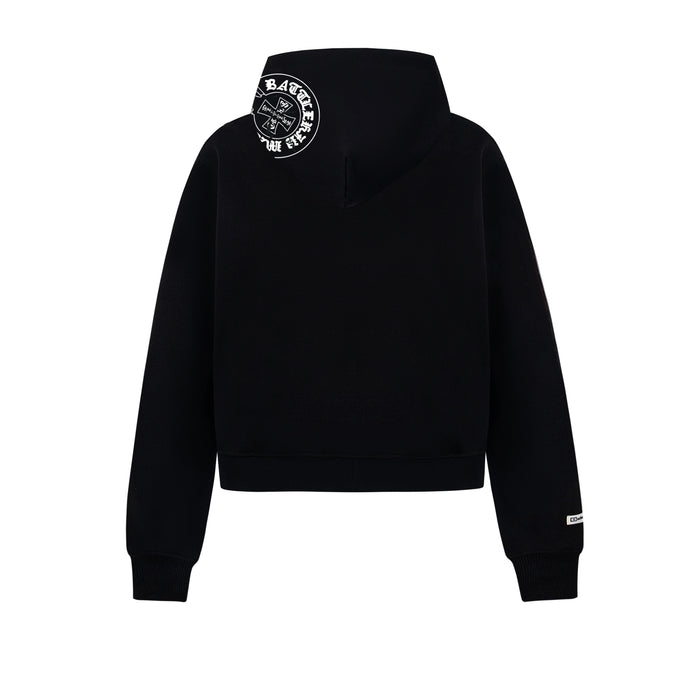 Back view of black pullover hoodie with small circular logo printed at the upper left shoulder