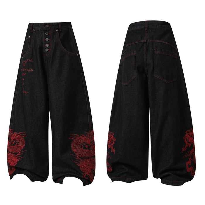 Front and back view of black wide-leg denim pants with red dragon embroidery and exposed button fly