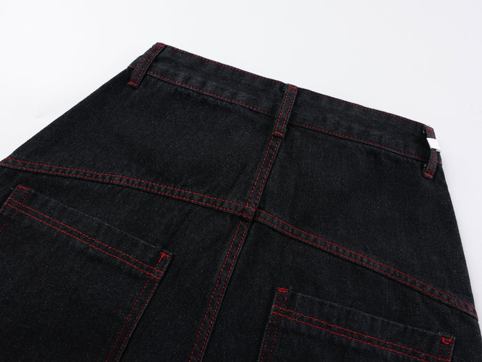 Back waistband close-up showing belt loops, yoke seams, and red contrast stitching