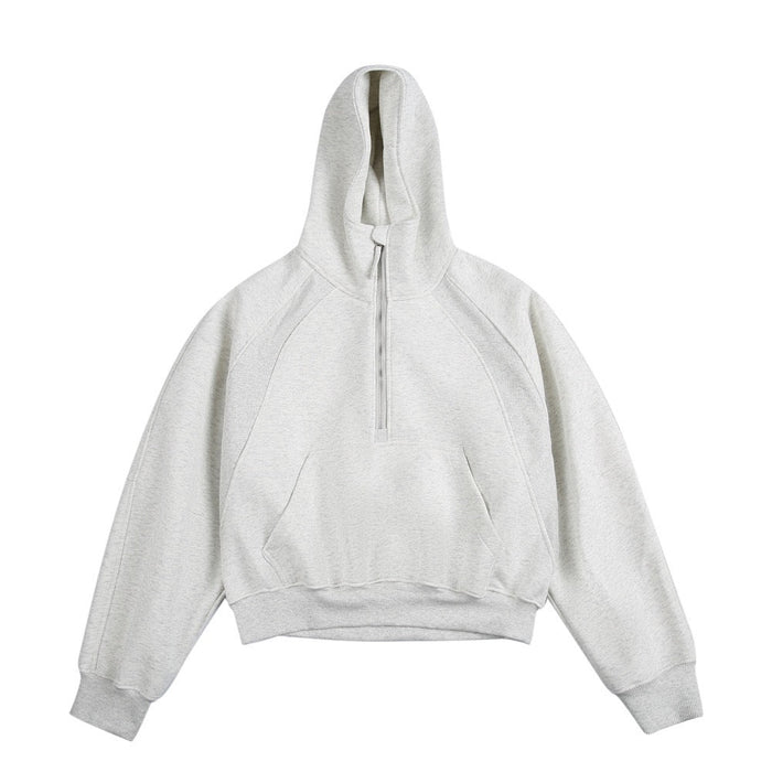 Light gray half-zip cropped hoodie with hood and kangaroo pocket, front view