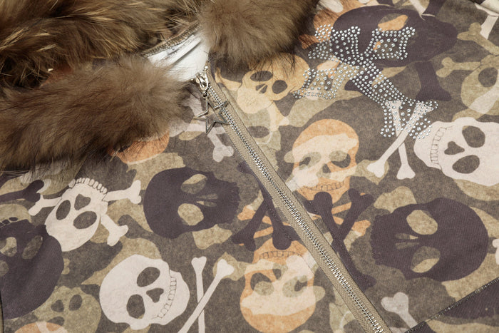 Close-up of front zipper and rhinestone skull graphic on camouflage bomber hoodie jacket