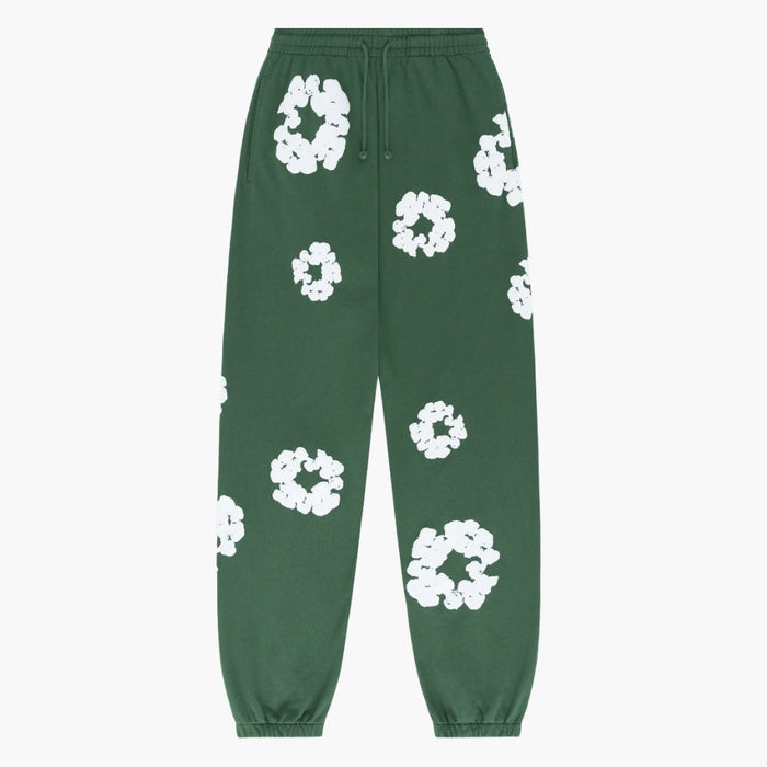 Forest Green “Cotton Wreath” Denim Tears Sweatpants feature an elastic waistband and cuffs, adorned with white floral prints—a signature streetwear design from Denim Tears.