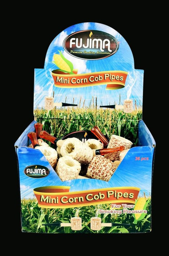 A slightly angled close-up of the 36-pack Mini Corn Cob Pipe from Fujima, showcasing a pile of small, natural-colored smoking pipes.