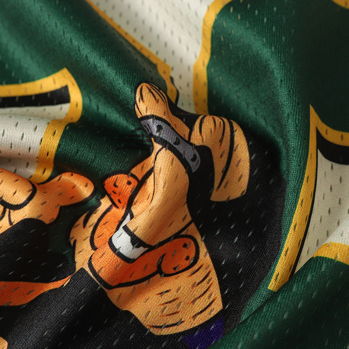Close-up of a Garfield graphic jersey fabric in green, white, and black with bold star-style streetwear artwork