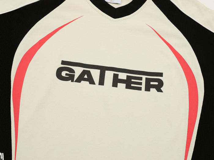 Cream and black V-neck athletic tee with bold GATHER logo and red curved side graphics